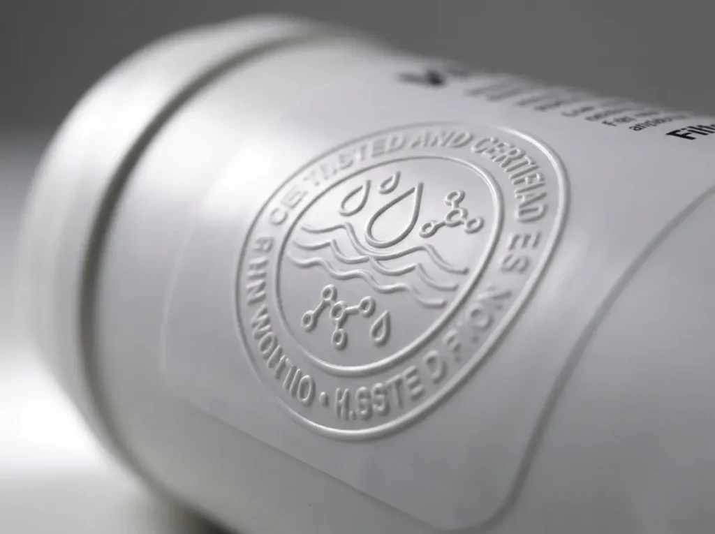 Macro close-up of an NSF certification seal printed on a water filter cartridge label